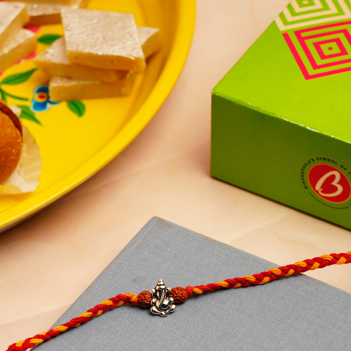 Ganesha Silver Rakhi with Kaju Barfi