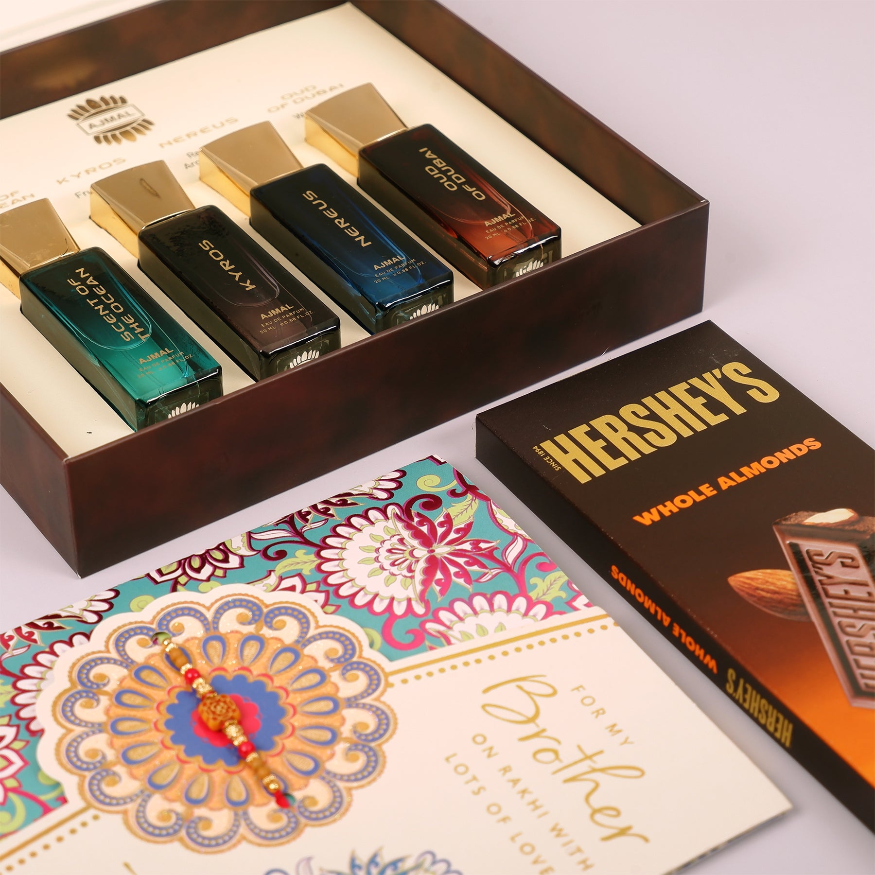 Oud Of Dubai Perfume with Rakhi Greeting Card and Hersheys Bar