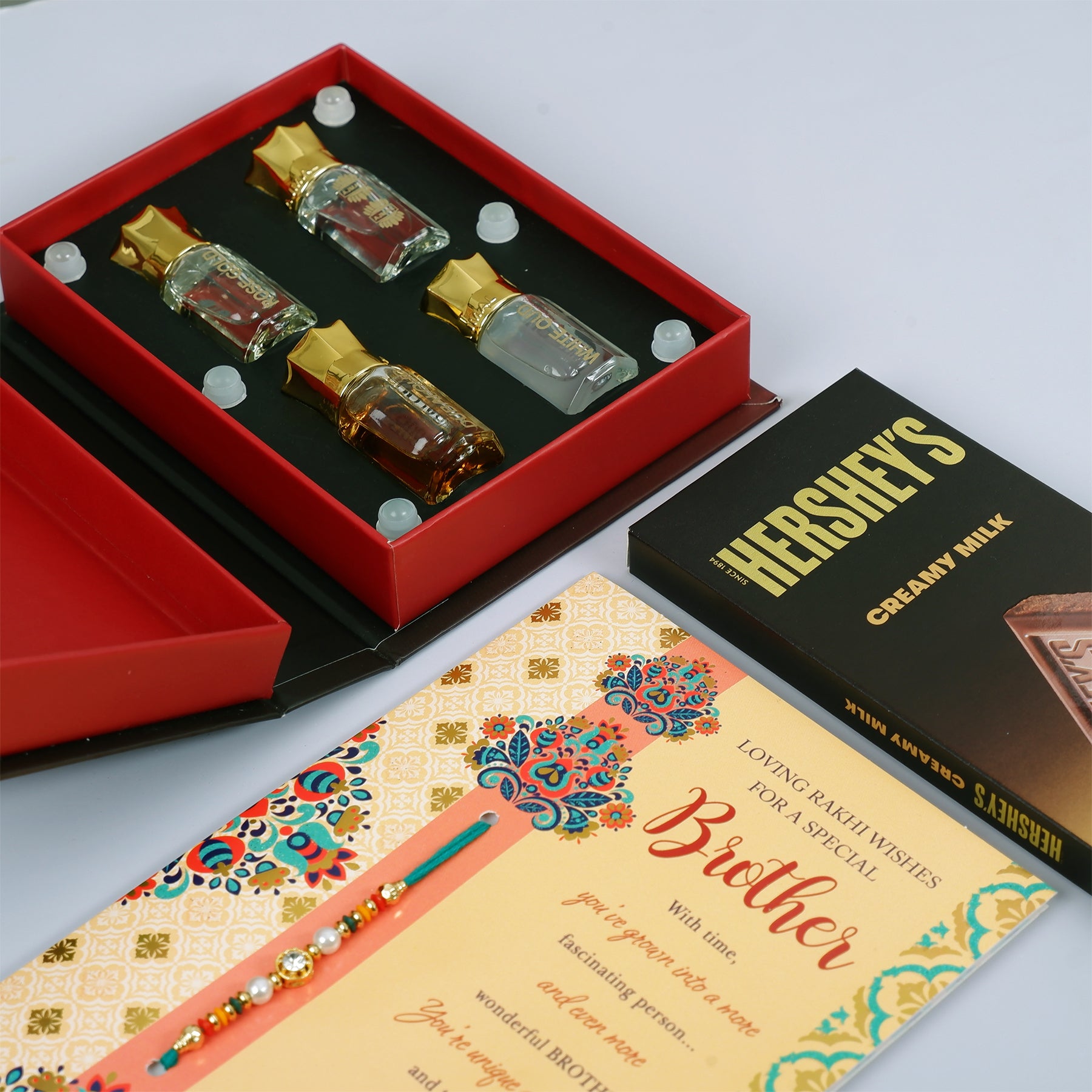Ajmal Gold Series Perfume with Rakhi Greeting Card and Hersheys Bar