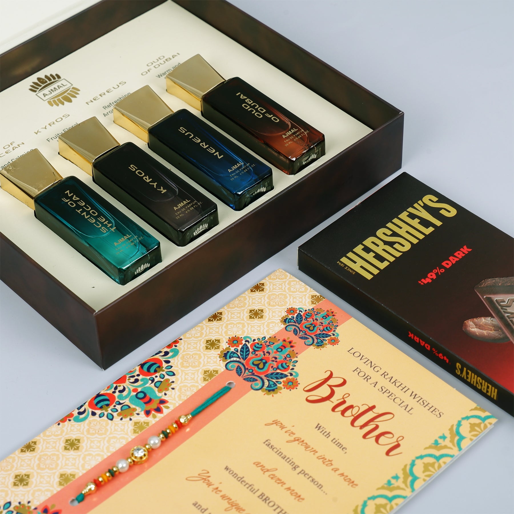 Oud Of Dubai Perfume with Rakhi Greeting Card and Hersheys Dark Chocolate