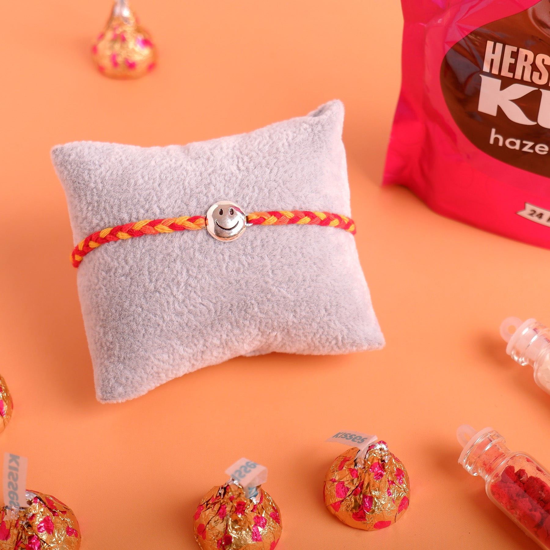 Smiley Silver Rakhi with Hersheys Kisses Hazelnut n Cookies