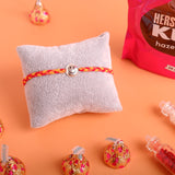 Smiley Silver Rakhi with Hersheys Kisses Hazelnut n Cookies