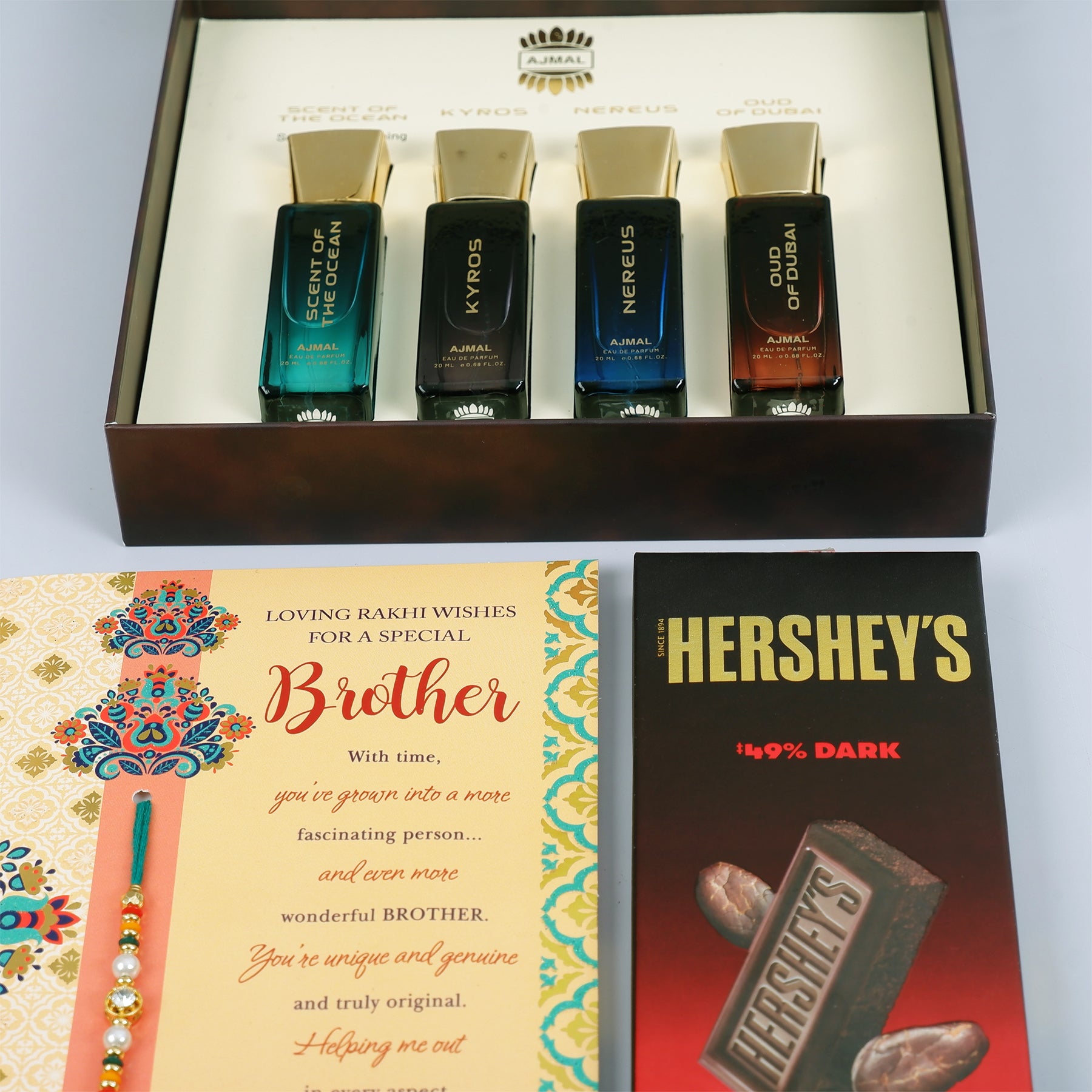 Oud Of Dubai Perfume with Rakhi Greeting Card and Hersheys Dark Chocolate