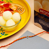 Om Rakhi with Rasgulla