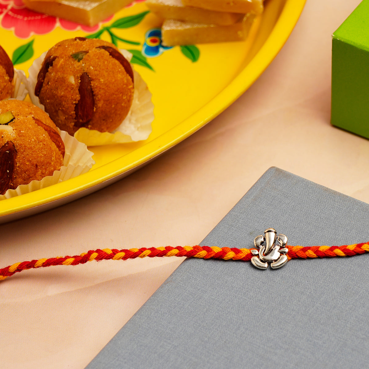Shree Ganesha Silver Rakhi with Besan Ladoo