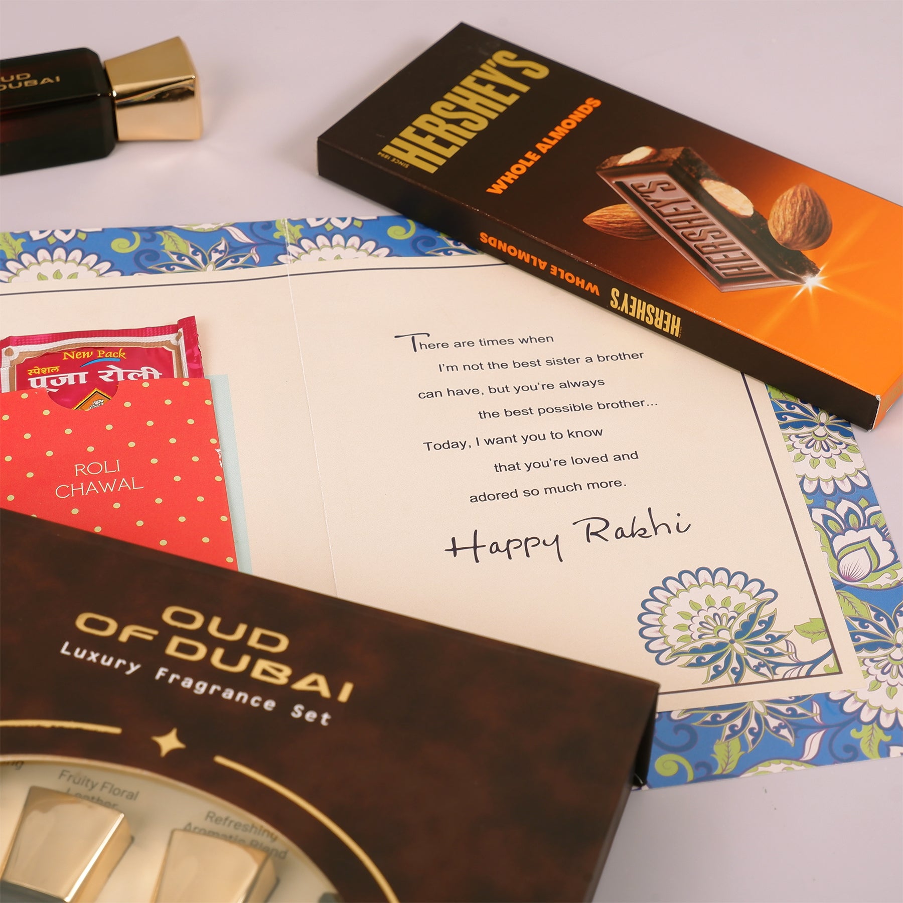 Oud Of Dubai Perfume with Rakhi Greeting Card and Hersheys Bar