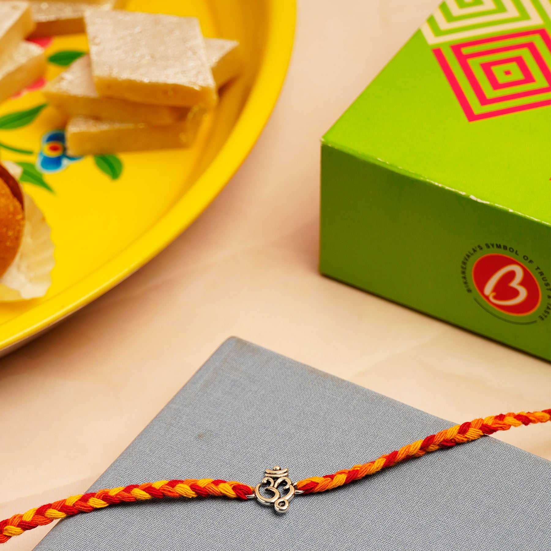 Shree OM Silver Rakhi with Kaju Barfi