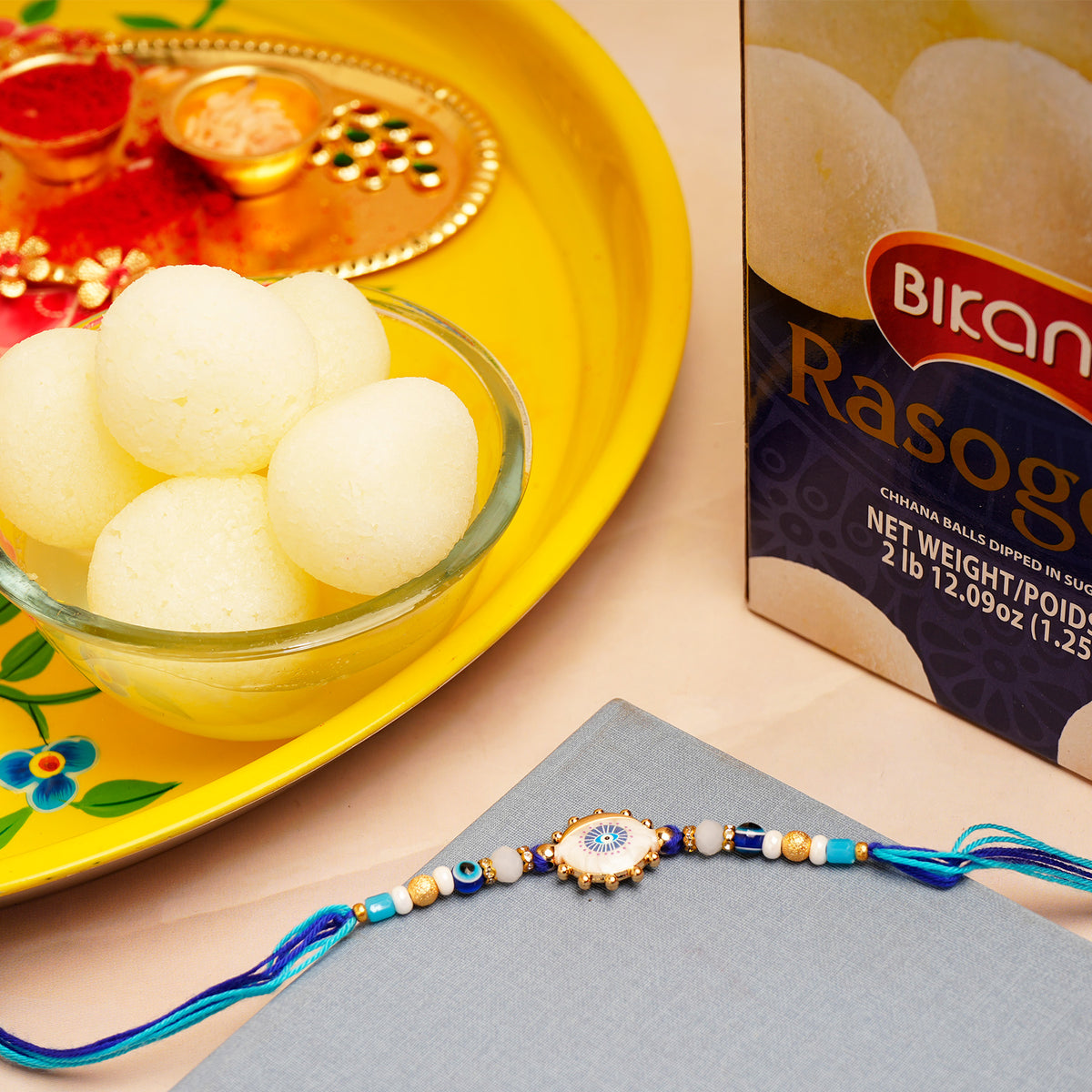 Sacred Evil Eye Rakhi with Rasgulla