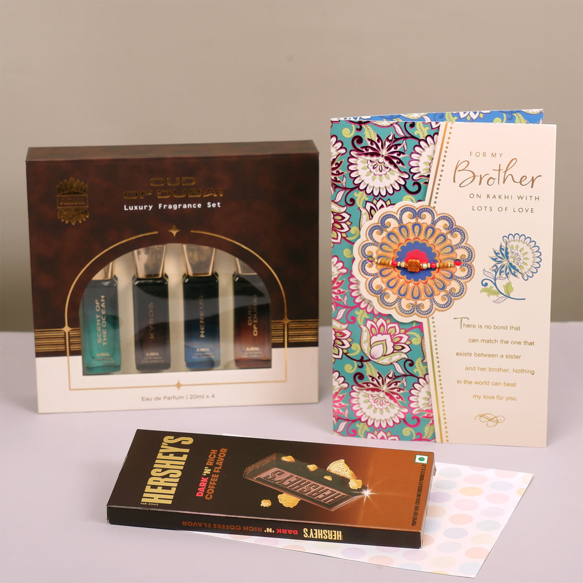 Oud Of Dubai Perfume with Rakhi Greeting Card and Hersheys Coffee Chocolate