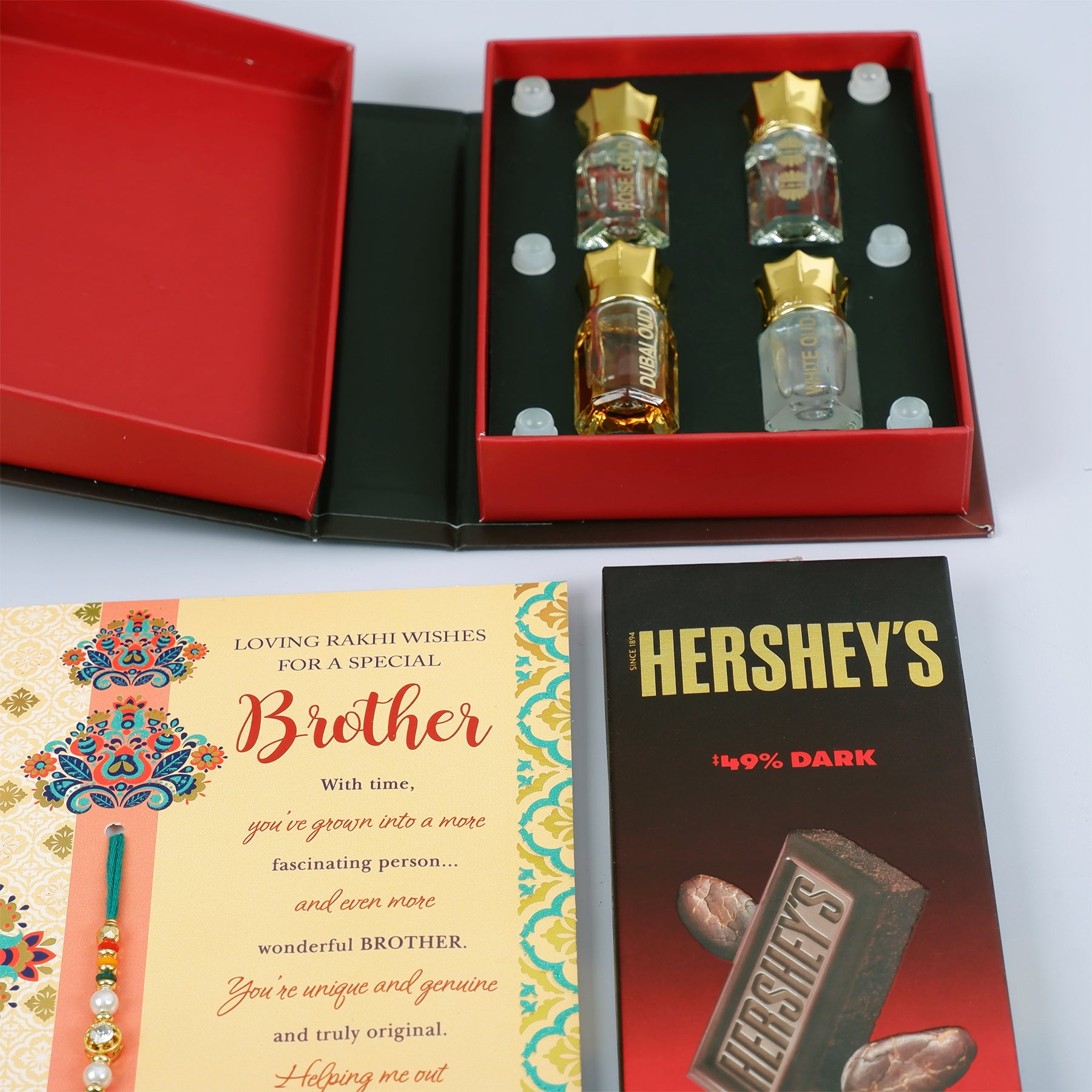Ajmal Gold Series Perfume with Rakhi Greeting Card and Hersheys Dark Chocolate