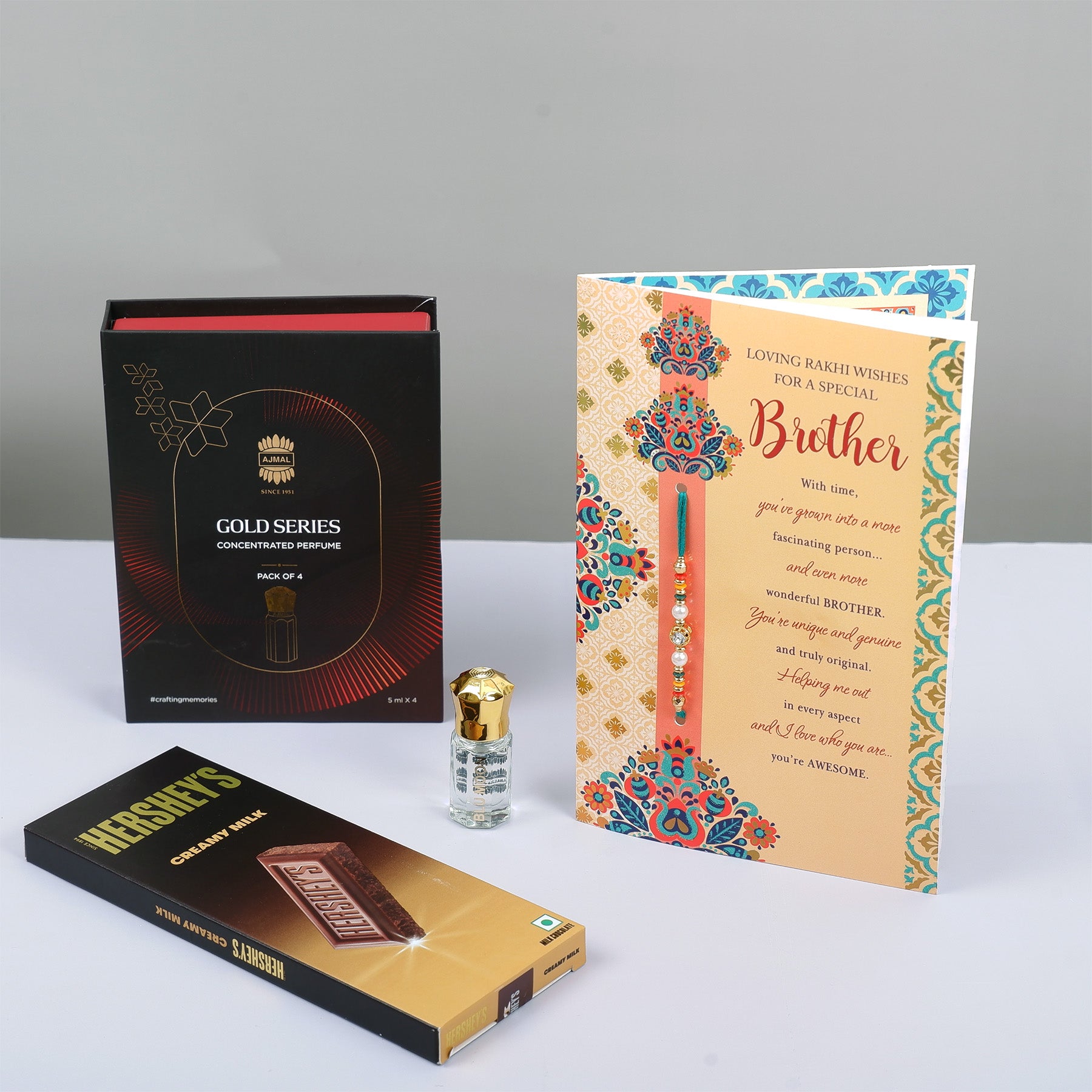 Ajmal Gold Series Perfume with Rakhi Greeting Card and Hersheys Bar