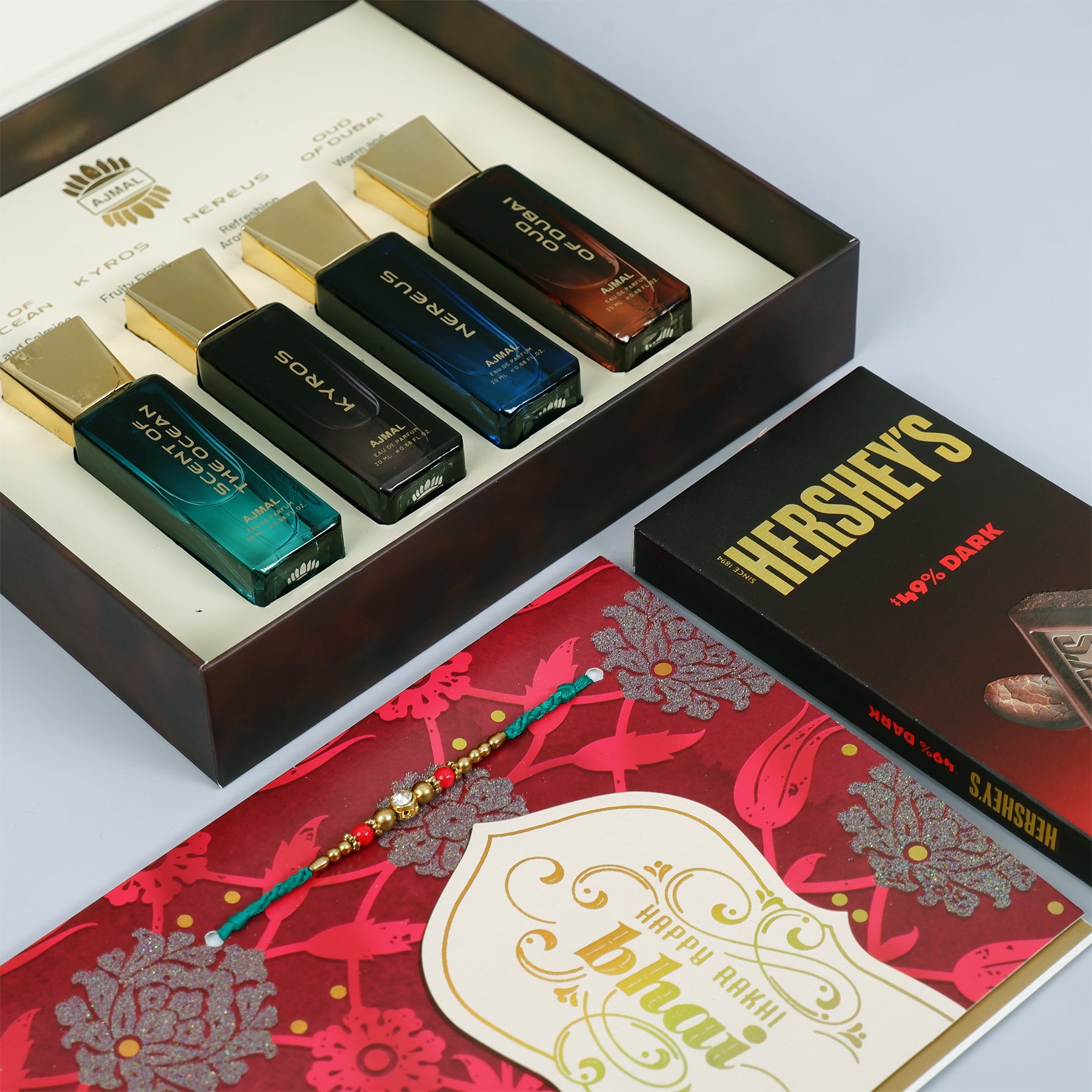 Oud Of Dubai Perfume with Rakhi Greeting Card and Hersheys Dark Chocolate Bar