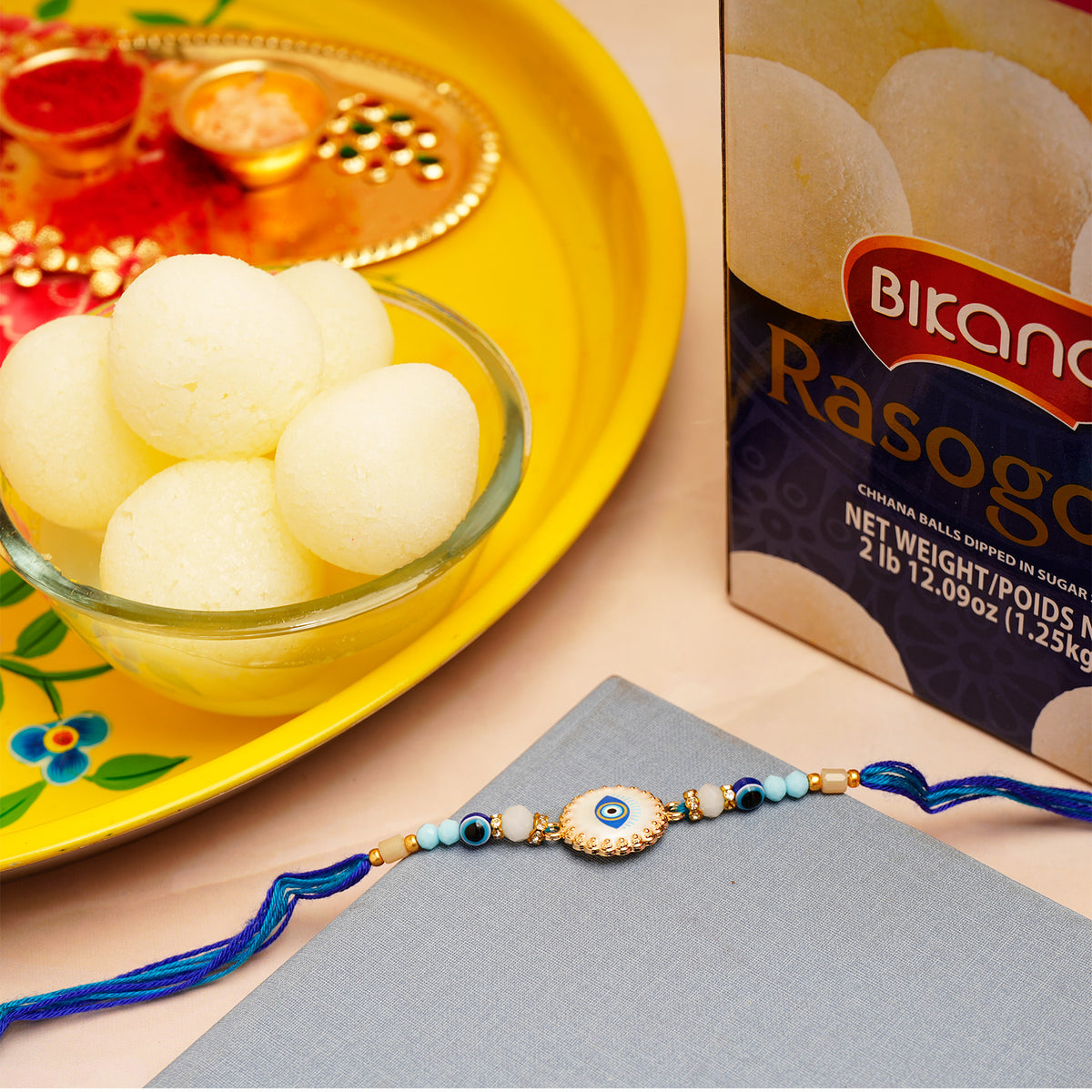 Designer Evil Eye Rakhi with Rasgulla