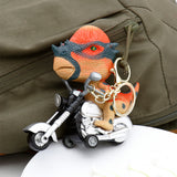 Dino Bike Ride Keychain