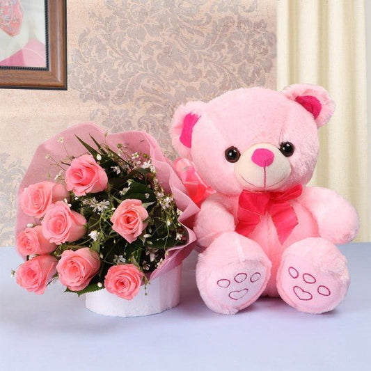 8 Pink Roses- Pink paper packing- 1 Pink Teddy Bear (10 inches)