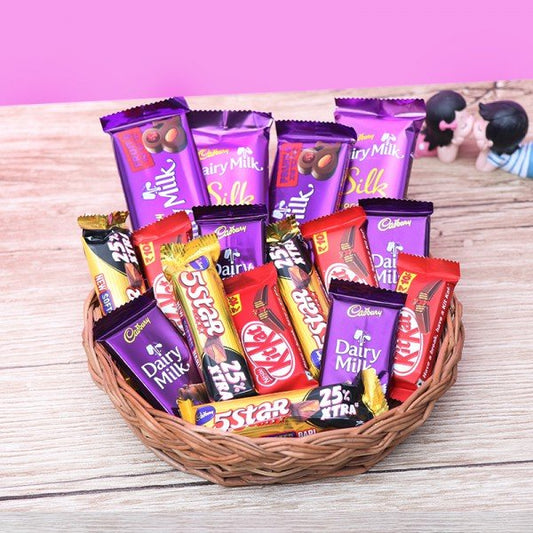Cane Basket With 4 Dairy Milk Chocolate (13.2 Gm), 4 Kitkat Chocolate (13 Gm), 4 Five Star Chocolate (22.4 Gm), 2 Dairy Milk Silk (60Gm) And 2 Dairy Milk Fruit And Nut (40 Gm)