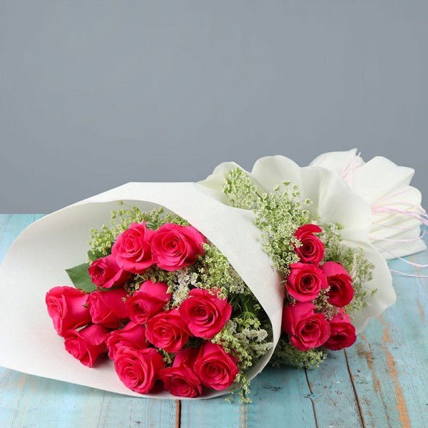 18 Pink Roses Beautifully Arranged in a Paper Packing