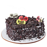 Sweet Blossoms Red roses with Black forest Cake